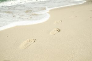 foot step in sand on beach